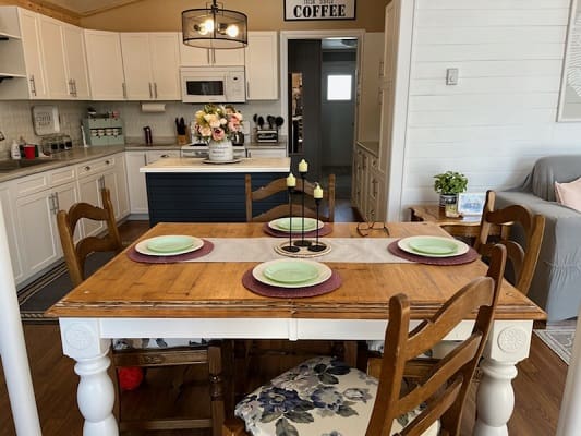 Cozy kitchen with dining table setup.